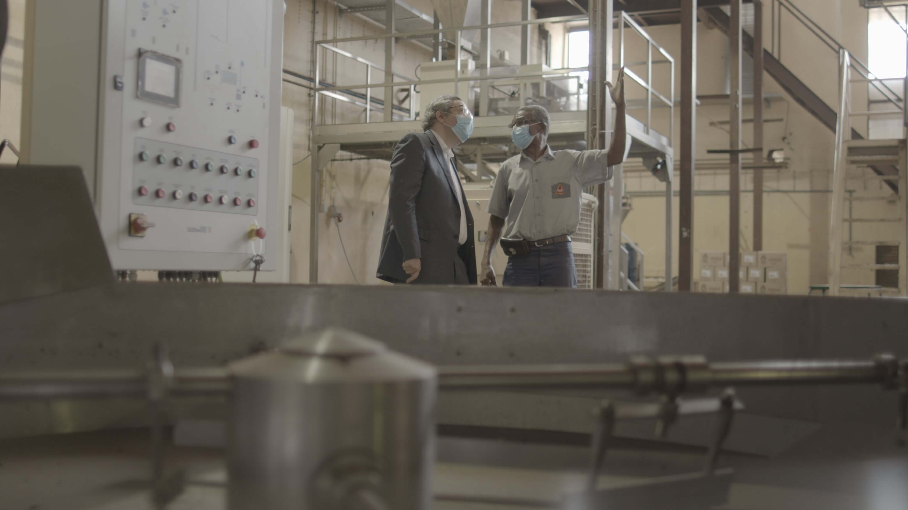 shot of two people in a manufacturing facility