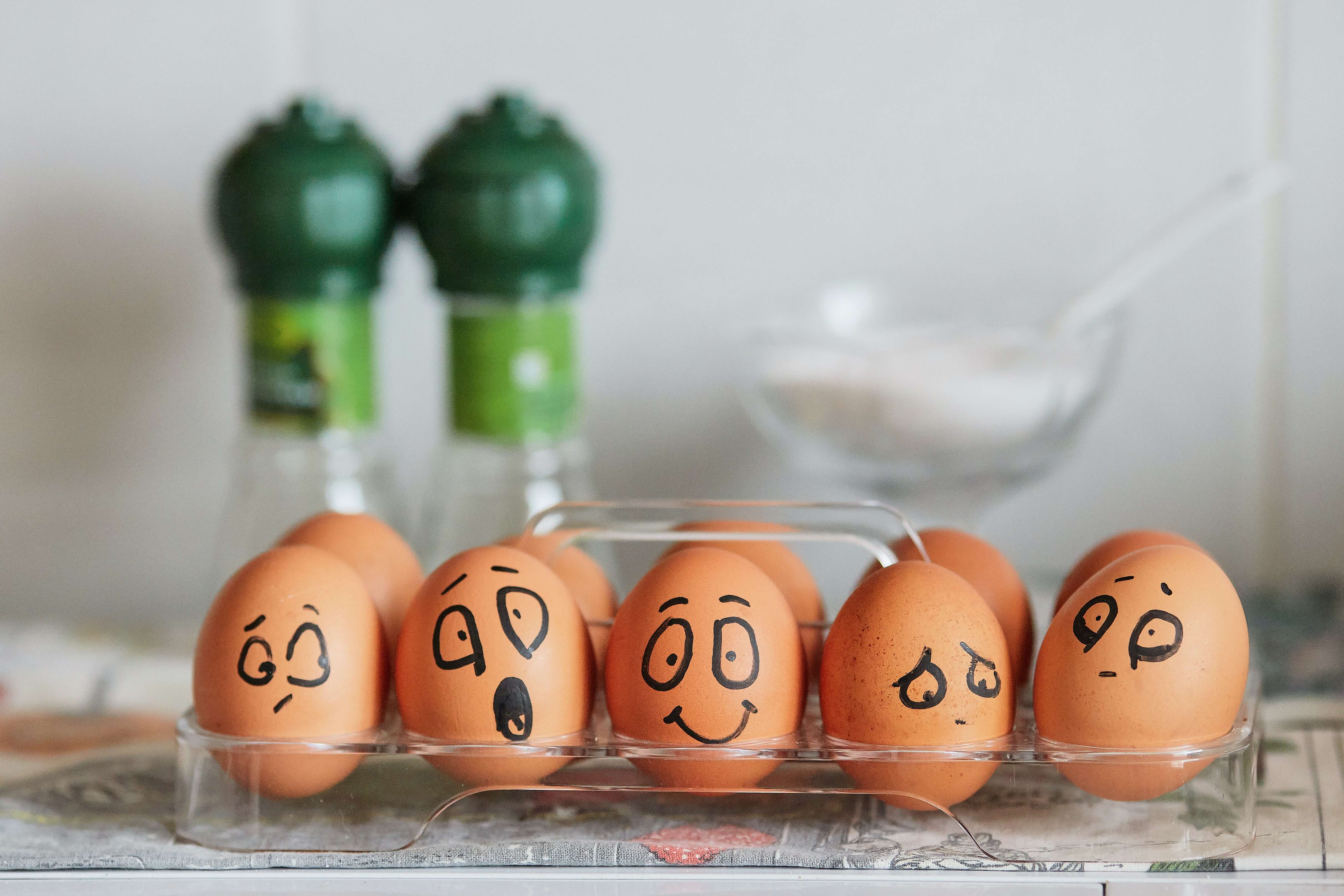 eggs with faces drawn on them