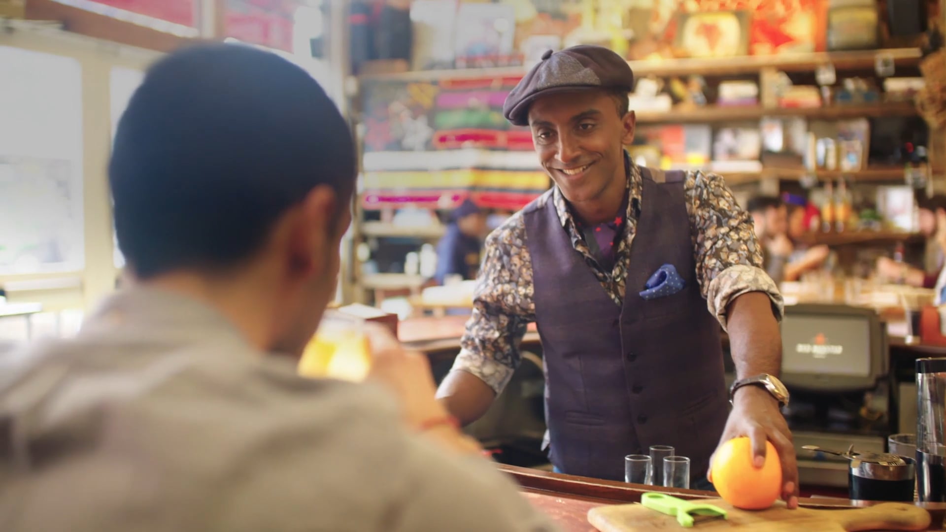 A shopkeeper serving a customer, from a Casual film
